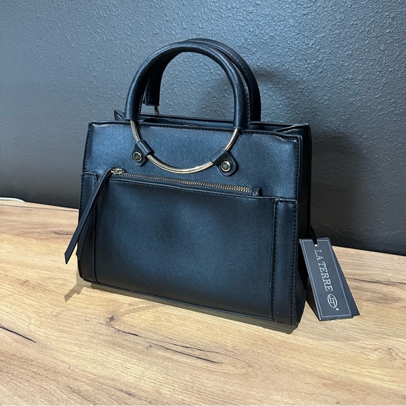 la Terre Handbags - NWT La terre black hand bag circle hoop handles faux leather gold